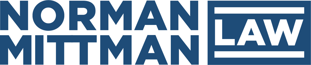 Blue Norman Mittman Law Logo