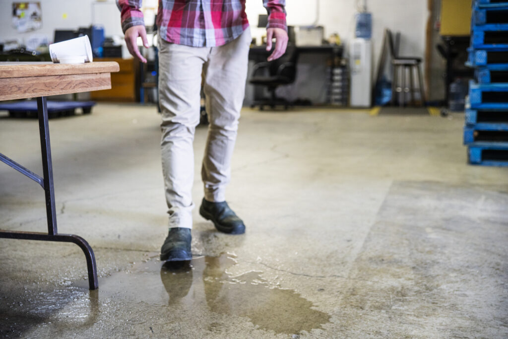 a puddle that has no caution sign to prevent a slip and fall accident